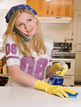 Woman cleaning her counter to protect family from food contamination